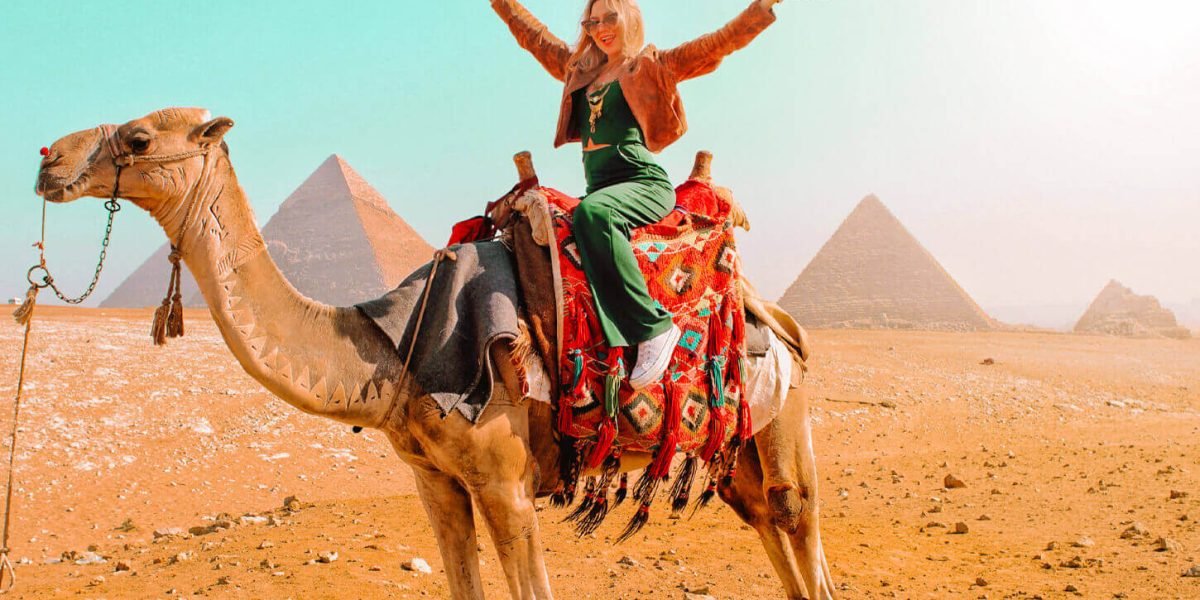a-wonderful-shot-of-a-girl-on-the-camel-in-front-of-the-pyramids a-wonderful-shot-of-a-girl-on-the-camel-in-front-of-the-pyramids